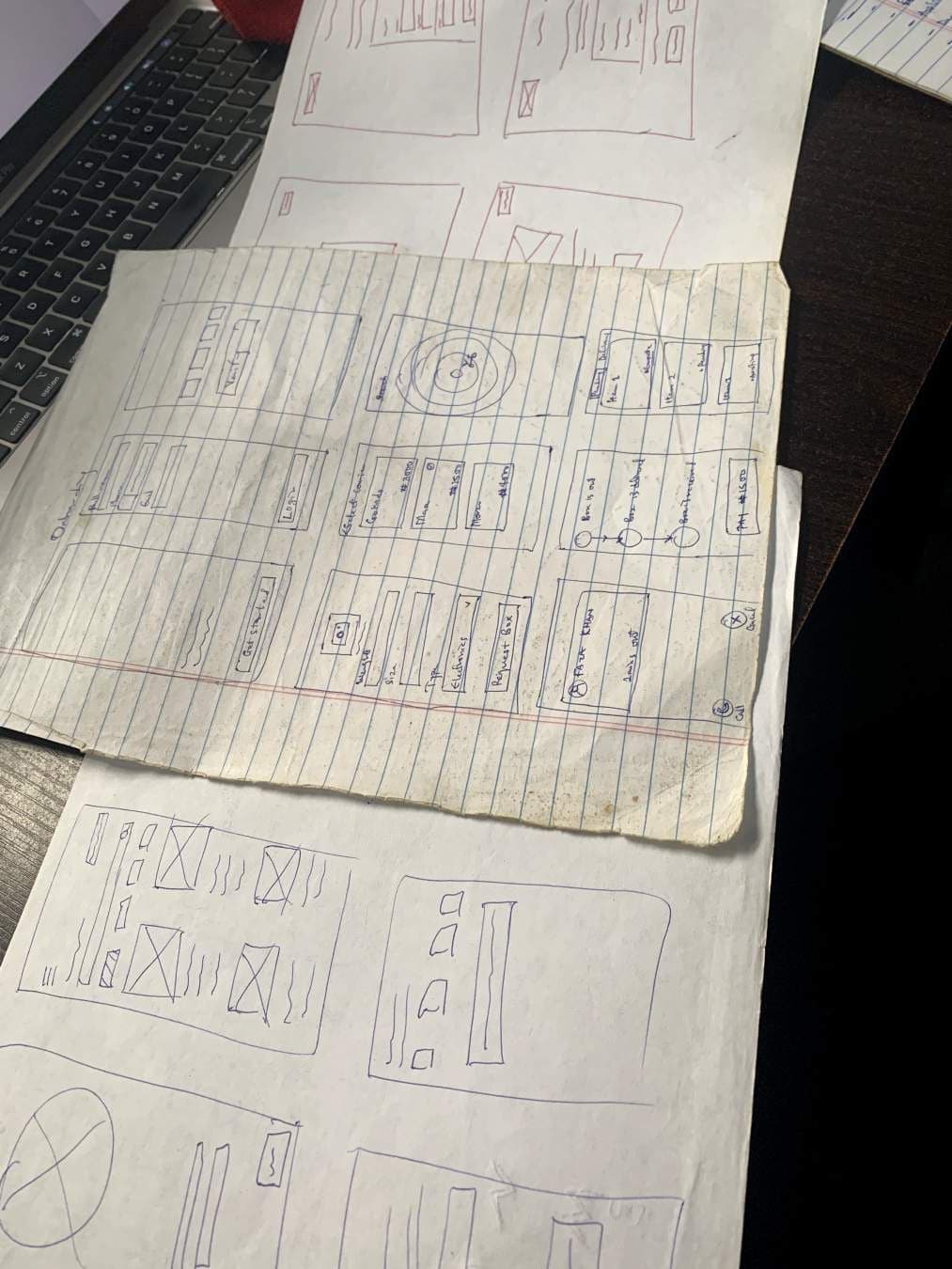 Paper sketches of app screens
